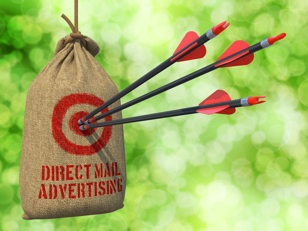 Direct Mail Advertising - Three Arrows Hit in Red Target on a Hanging Sack on Natural Bokeh Background.-1